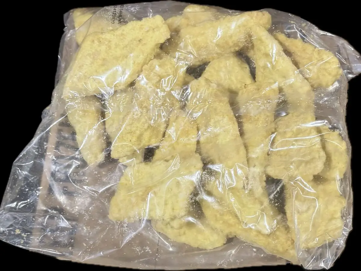 Frozen breaded chicken strips in plastic bag