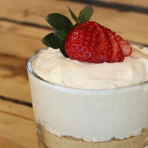 Creamy strawberry cheesecake parfait in glass