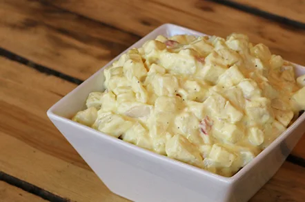 Creamy potato salad in white square bowl