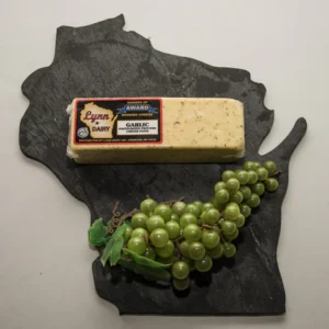 Garlic cheese and green grapes on slate
