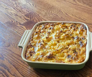 Cheesy baked egg casserole in ceramic dish